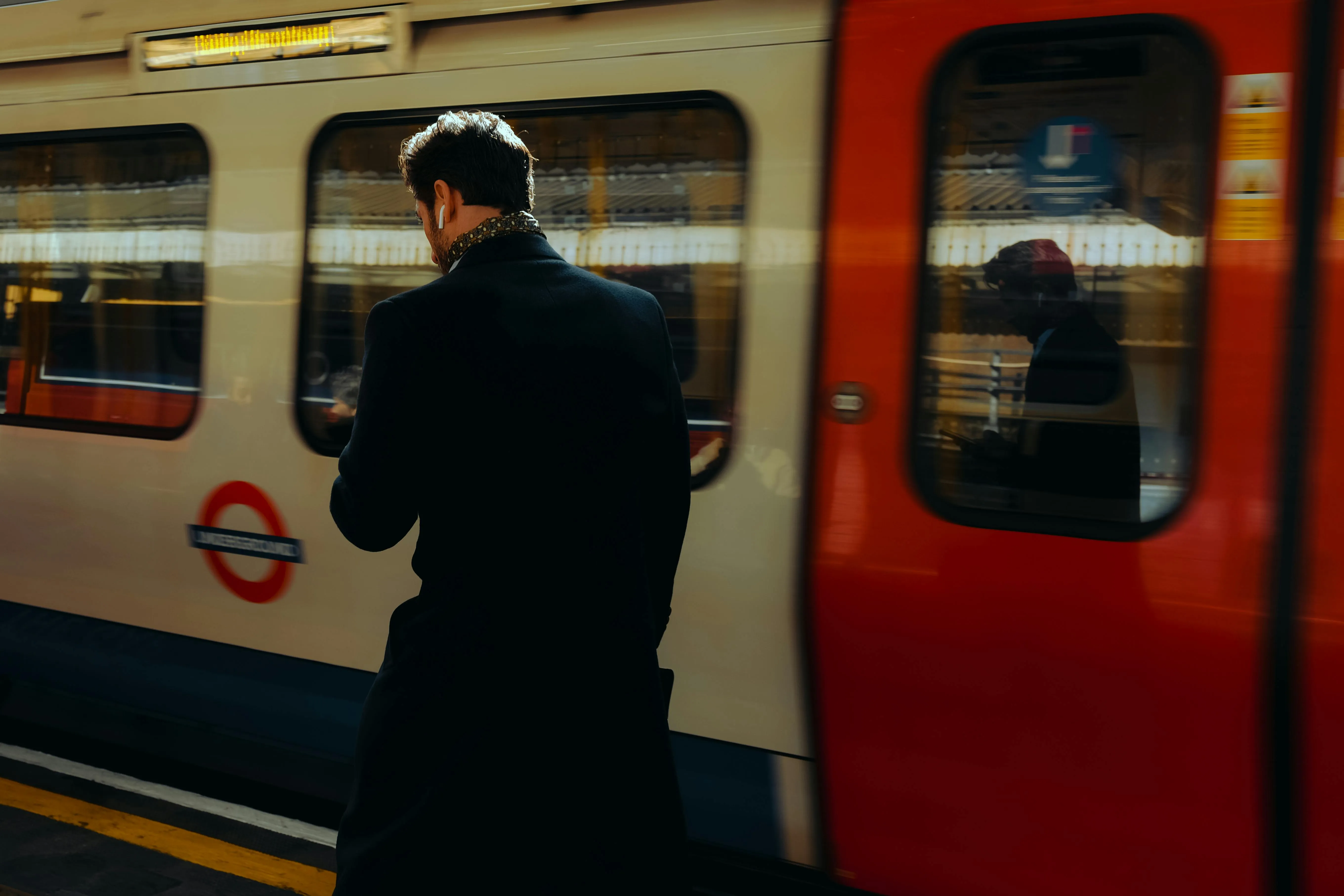 Man stood in front of a train